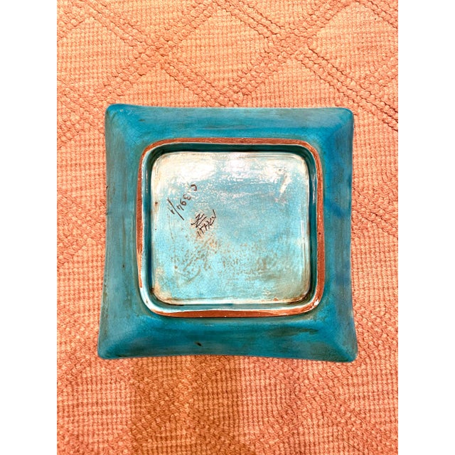 LOVE this glaze color! It's that cerulean turquoise of the Mediterranean Sea color to the glaze. It has a black design of...