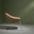 This tubular metal lounge chair features a sisal seating and backrest, creating a unique design where the seat hangs...
