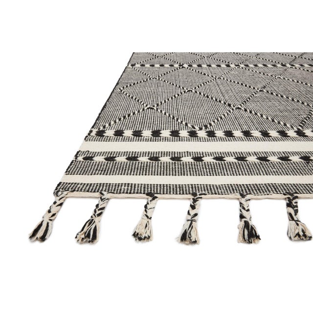 Hand-loomed of wool, cotton and other fibers in India, the Sawyer Collection features bold graphic designs. Textural,...