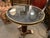 Lovely single pedestal marble top table. Brass surround and brass accents.