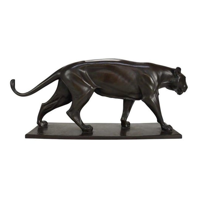 An antique German bronze sculpture by Christian Aeckerlin, depicting a striding lioness. This finely cast bronze features...