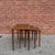 Clean, well-proportioned nesting tables with softly rounded edges, tapered legs, and beautifully matched teak grain...