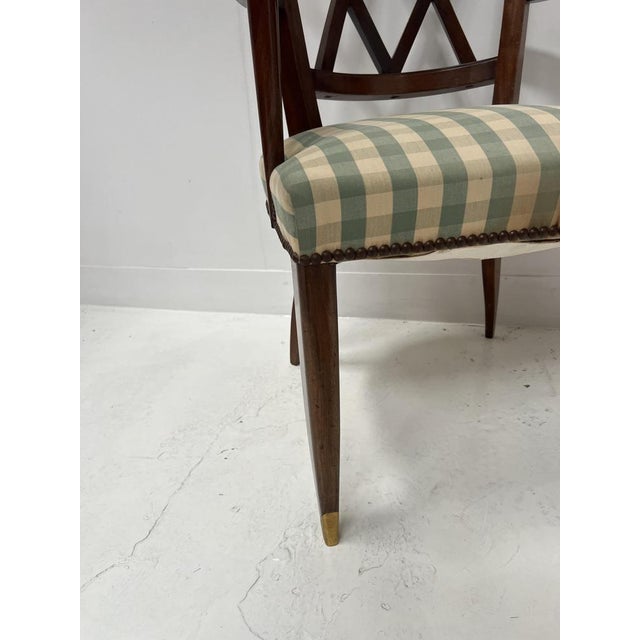 Art Deco mahogany office chair Four tapered legs with bronze sabots X-shaped cross-braced backrest Striped fabric seat...