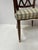 Art Deco mahogany office chair Four tapered legs with bronze sabots X-shaped cross-braced backrest Striped fabric seat...