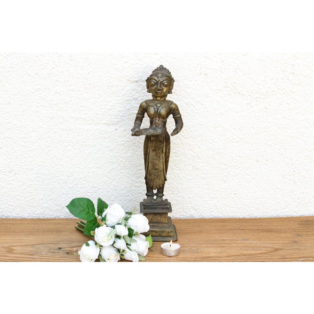 A monumental and stately ritual masterpiece featuring an imposing 14.5-inch silhouette, extensive incised jewelry...