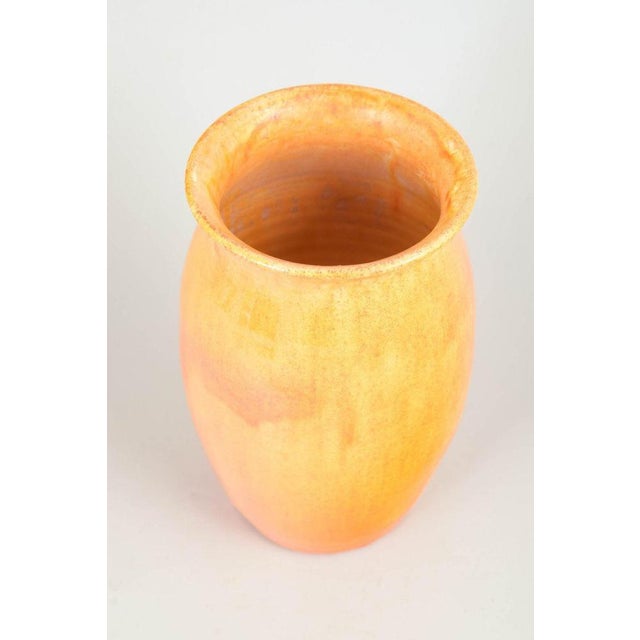 Kähler, yellow glazed vase. Elegant vase in glazed earthenware with a softly tapering form and slightly flared rim....