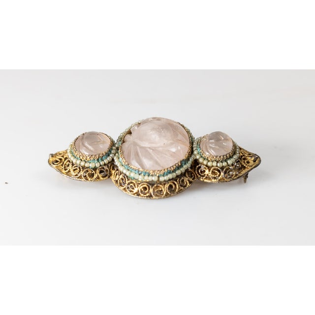 We are selling this Chinese export gilt silver filigree brooch pin. This pin has filigree body with gilt surface that...