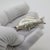 Distinguished by its substantial feel and poetic aquatic theme, this rare vintage silver figurine depicts a detailed carp...