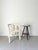An antique side table in an ebonised finish with turned tripod legs and chunky button feet. This stylish occasional table...