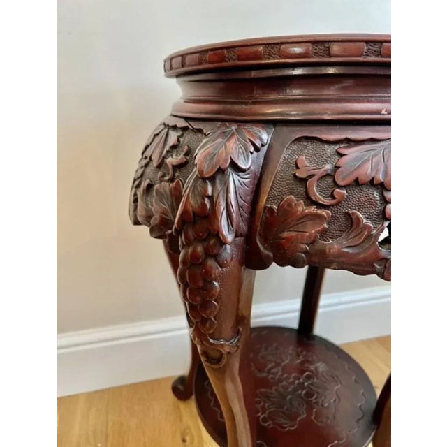 Antique oriental quality carved jardiniere stand having a quality carved circular top above a wonderful carved frieze with...