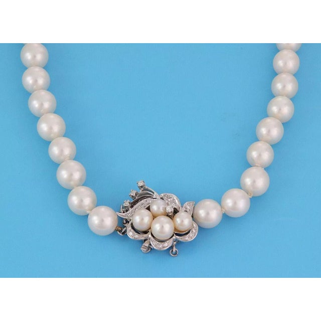 Pure perfection and elegance describes this stunning Estate single strand pearl necklace. The lovely floral clasp is...