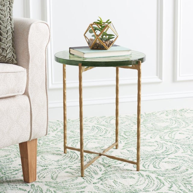 Indulge your decor with a dash of decadence with this stunning Tengah Accent Table. The eye-catching undulations of...