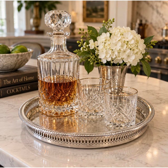 The round tray has beautiful engraving, finished with a pierced gallery border and handsome rope-twist rim. This is a...