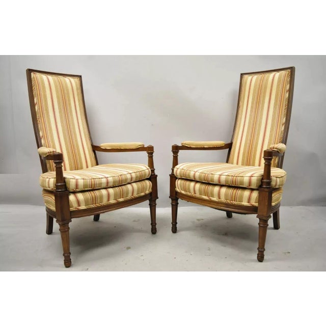 Vintage Hollywood Regency French Style High Back Upholstered Arm Chairs - a Pair. Item features tall backs, solid wood...