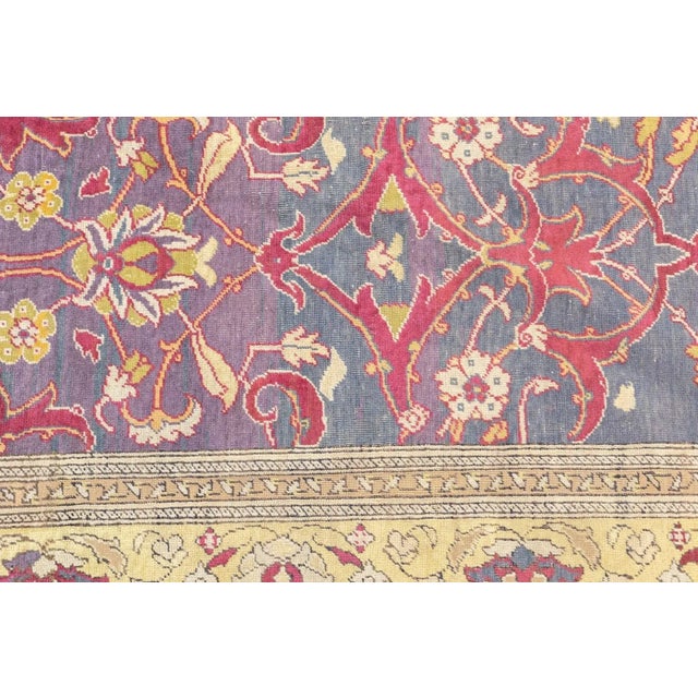 Better woven than a contemporaneous Oushak, this roomsize piece from near Istanbul, shows an abrashed teal field with an...