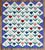 Pair of stunning pieced tulip motif quilts with purple border. Roughly twin size though measures slightly smaller than a...