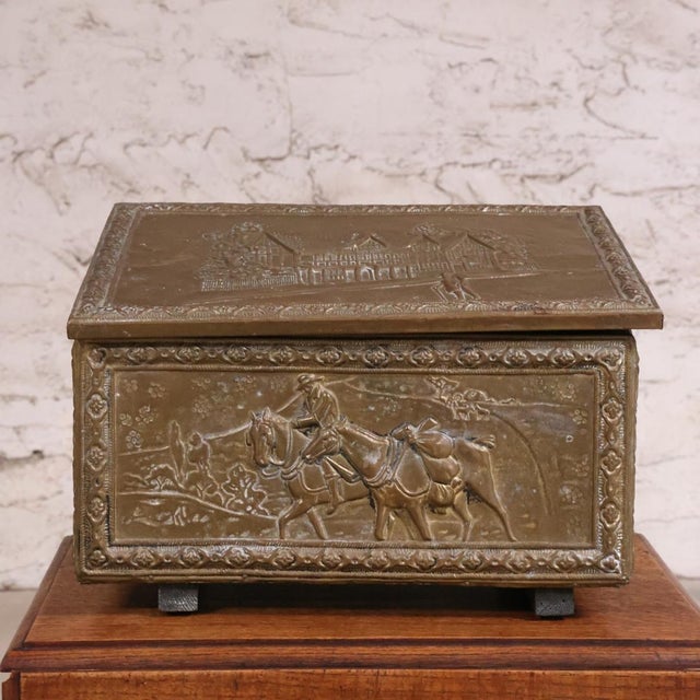 This 19th Century Brass-Over-Wood Paneled Box is a striking antique that showcases the refined craftsmanship and...