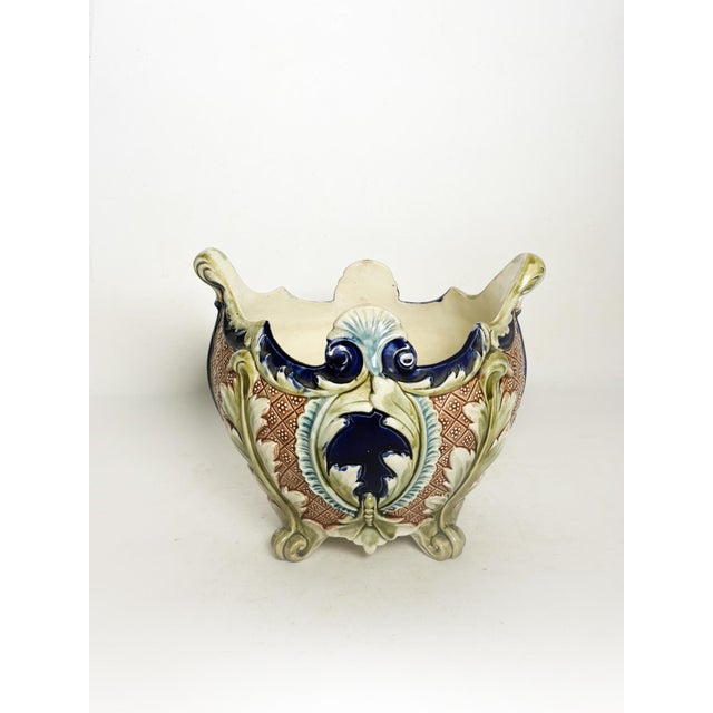 A majolica ceramic cachepot, France, 19th century, richly decorated in a style typical of the decorative production of the...