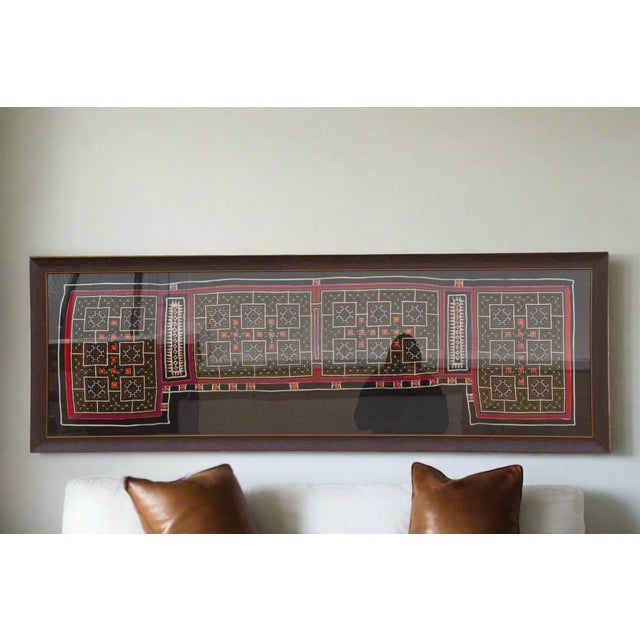 This extraordinary textile panel offers a captivating glimpse into the rich heritage of the Hmong people, an ethnic group...