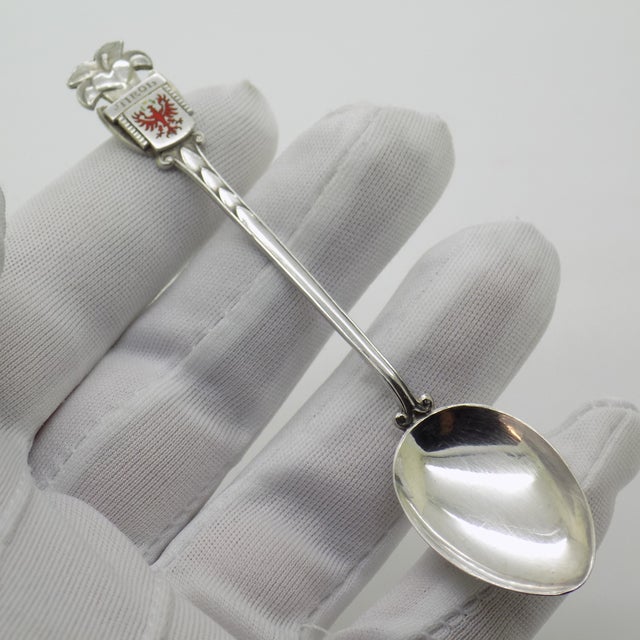 A vintage Austrian silver souvenir spoon from the 1970s and 1980s, hallmarked 800 together with a brand logo/name. This...