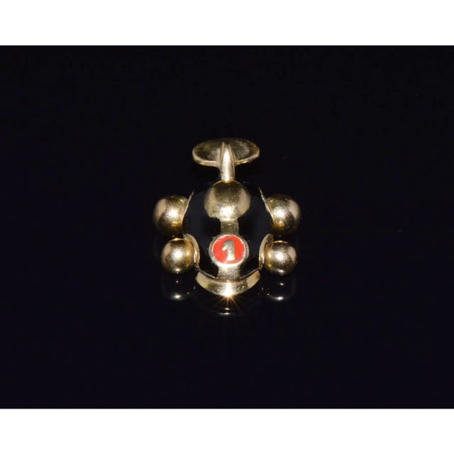 This authentic Aaron Basha Race Car charm is crafted in solid 18K yellow gold and detailed with glossy black enamel,...