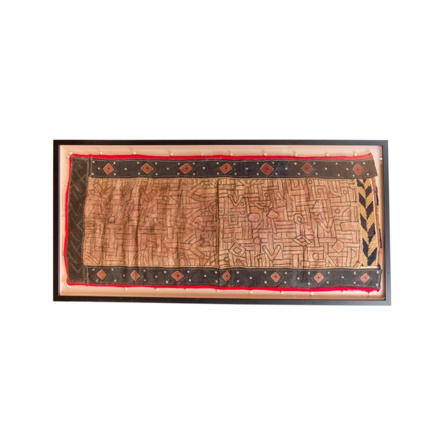 Handwoven by artisans of the Kuba tribe in the Democratic Republic of Congo, this one-of-a-kind raffia wall hanging blends...