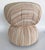Vintage Boho Upholstered and Cinched Pouf on Casters Offered for sale is a vintage pouf on casters that is upholstered in...