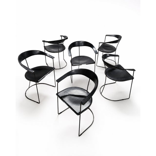 Set of 6 postmodern Canasta chairs, manufactured by Arrben Italia. Black leather and black metal rod frame. The leather...