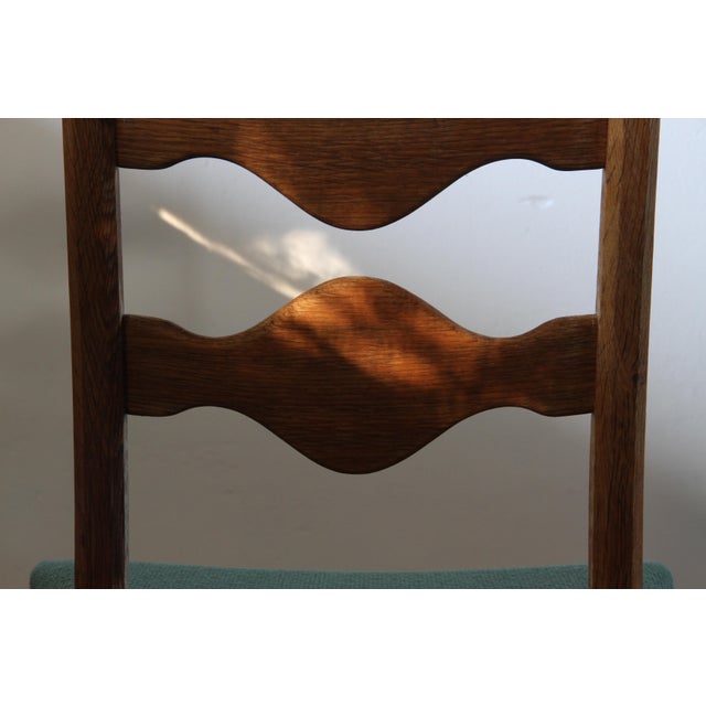 Set of six Danish "ladderback" chairs, carved from solid oak in the unmistakable brutalist-baroque style of Henning...