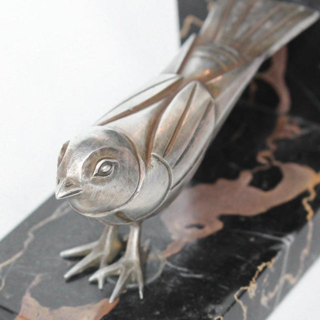 Art Deco, silvered bronze bird bookends on an original marble plinth. Signed too underside. Dimensions: H 10.5cm W 13.5m D...