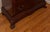 Traditional tall chest of five drawers in the Chippendale revival taste, with a serpentine front, reeded corner columns,...