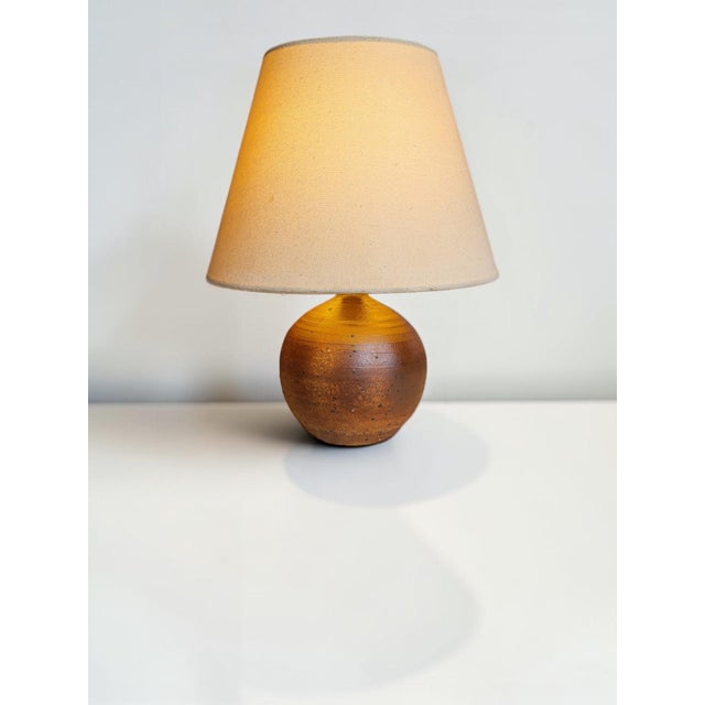 Stoneware globe lamp Height 19 cm Diameter 12.5 cm Unsigned, in good condition. European Plug (up to 250V).The wiring of...