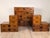 A Japanese tansu; includes a central tansu flanked by two step-shaped or tiered small tansu units, can be referred to as...