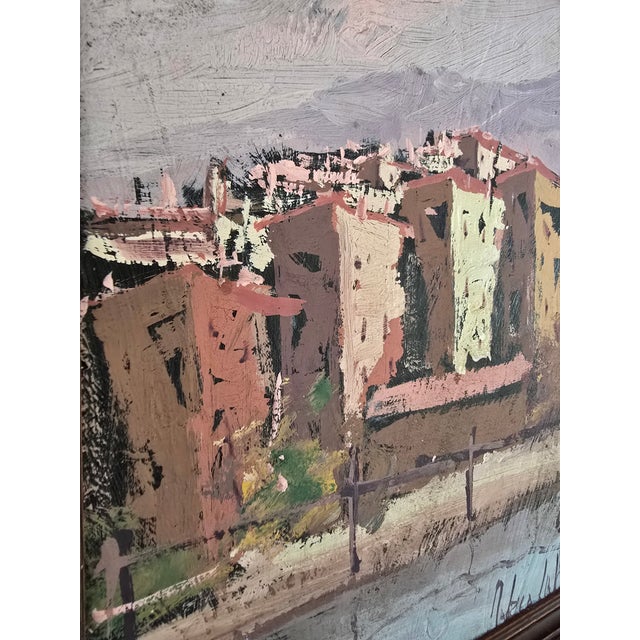 This charming original vintage oil painting captures a colorful Mediterranean-style village rendered with expressive...