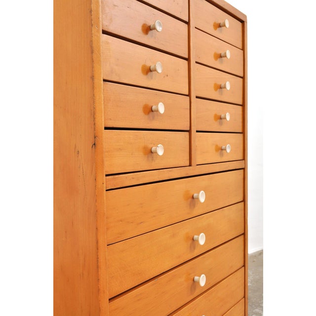 Beautiful beechwood chest of drawers. This heavy, solid school drawer cabinet from the 1950s has 15 drawers and brings a...