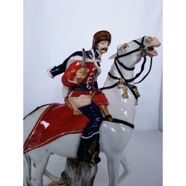 A magnificent and finely modeled antique Meissen porcelain equestrian figurine depicting a 19th-century military...