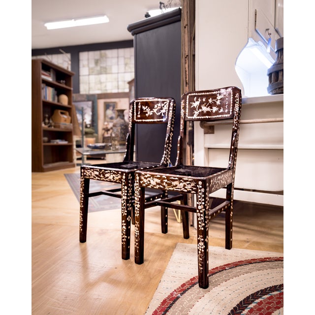 A Chinese lacquered mother of pearl chair set in beautiful condition.