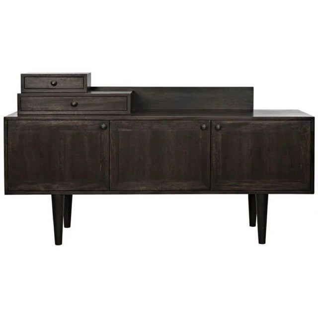 A sophisticated, modern take on a traditional sideboard, the Hermes has been expertly handcrafted of ebony finished...