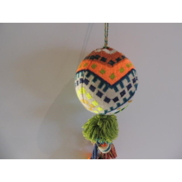 Indian woven Christmas tree ornament with hanging tassels Woven cotton threads. Siuze:3"D X 3"D x 10"L