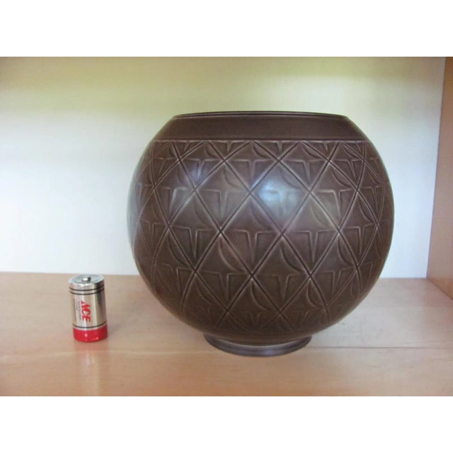 Great looking round vase by ROYAL COPENHAGEN, DENMARK. Brown glaze over a diamond pattern with enclosed design. Signed...