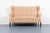 Very beautiful imposing wingback wall sofa on stained wood legs with spectacular colorful fabric upholstery. Produced in...