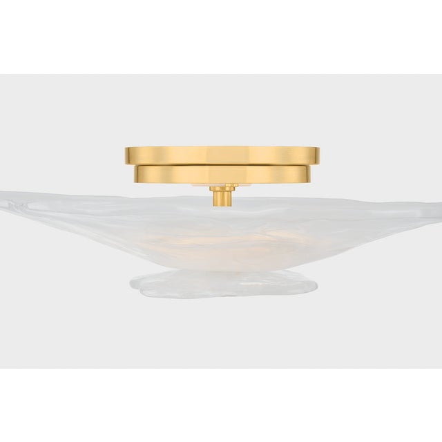 Soft, organic, floral. The petal-like layers of the Starlie flush mount create a stunning cloud-like bloom from below....