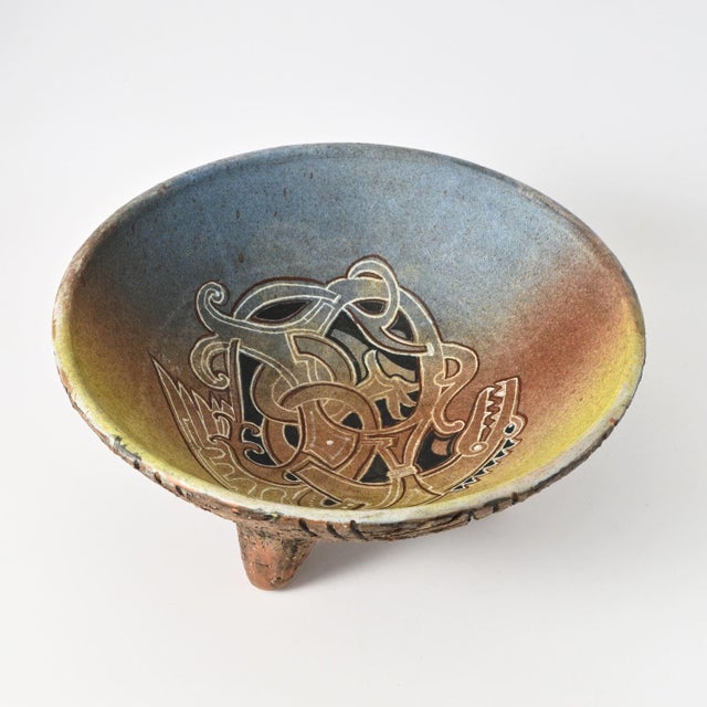 Large tripod bowl with Viking / early medieval style decoration. Made in 1970s in Sweden by Tilgmans Keramik. This piece...