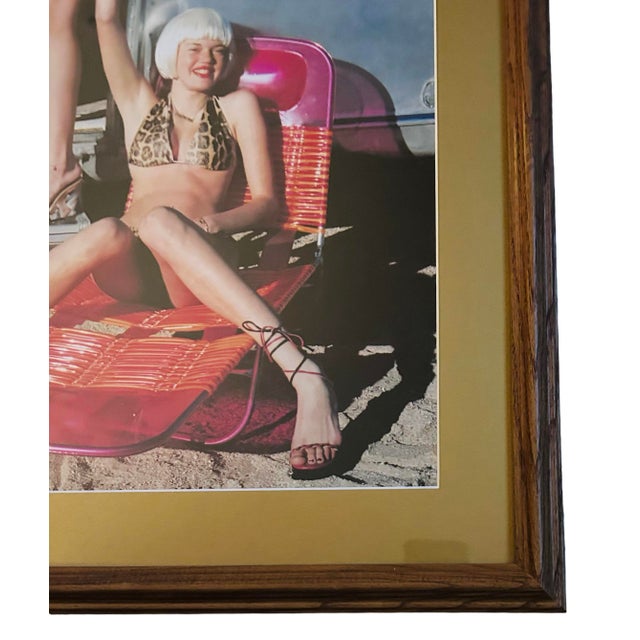 Famous fashion photographer Helmut Newton produced this work in 2002 . This piece showcases Newton's characteristic of...