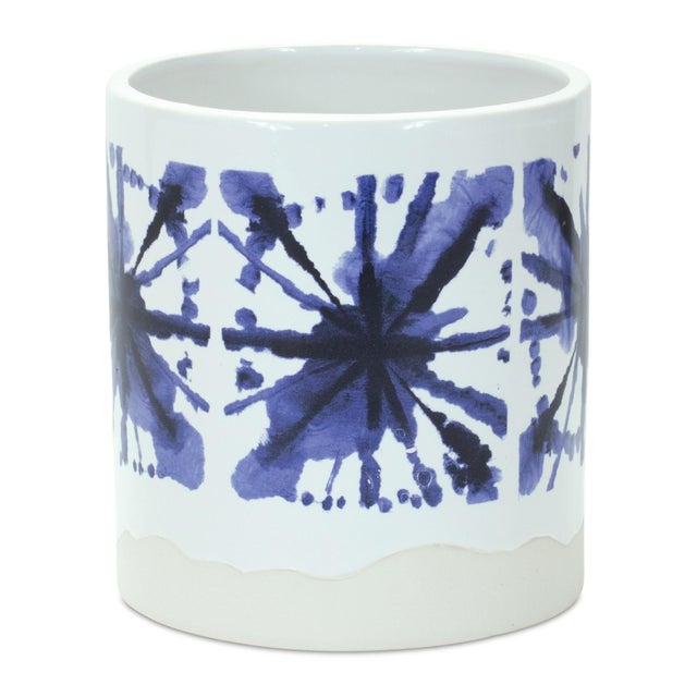 Add a splash of color and charm to your plant display with this set of Blue & White Tie-Dye Ceramic Pots. These eye-...