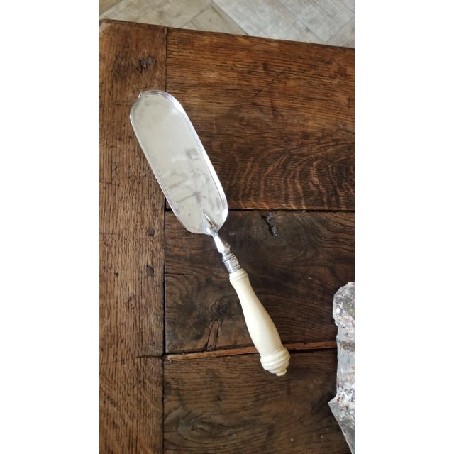 Beautiful antique English silverplate crumber with beautifully carved handle