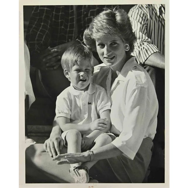 Lady Diana and Prince Harry is a vintage black and white Photograph realized in the 1980s. Good conditions. The on the rear.
