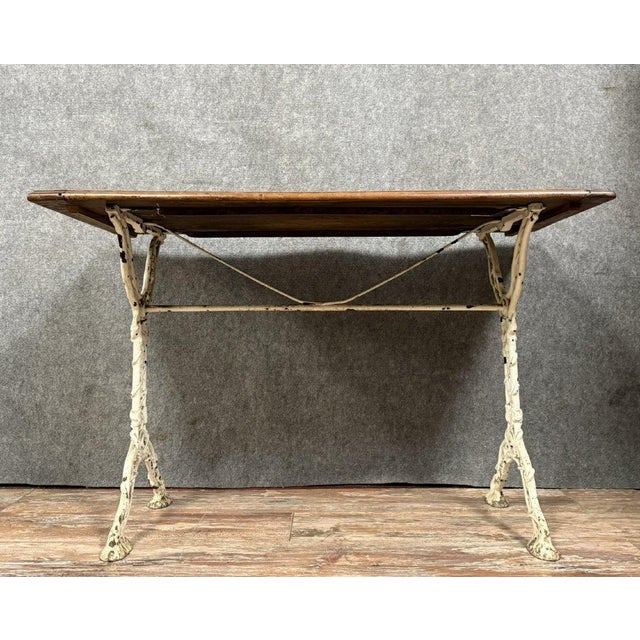 Based on a work by the Arras foundries circa 1880: Charming Napoleon III period bistro table in cast iron solid wood top...