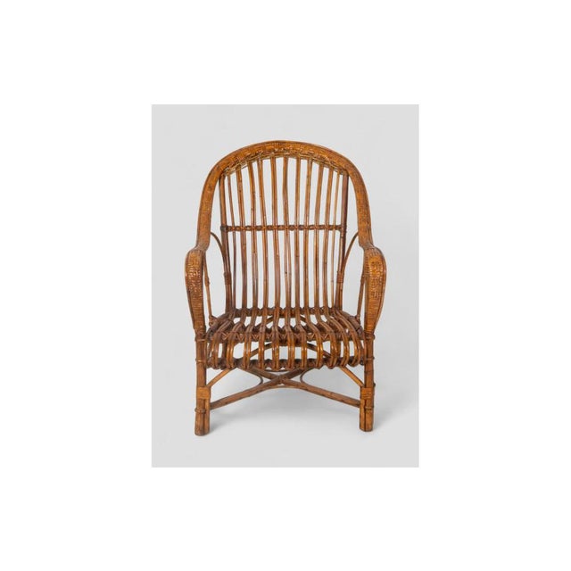 with its elegant silhouette and handcrafted curved rattan, this vintage armchair conveys timeless charm. The compact yet...