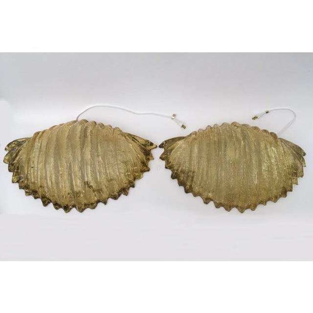 This incredible pair of large vintage resin shell form wall sconces are from the 70's. The resin shell form color is a...